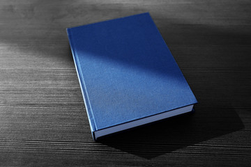 Book in hard cover on table