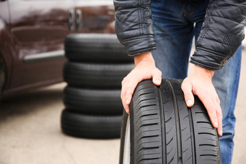Closeup view of man rolling wheel outdoors