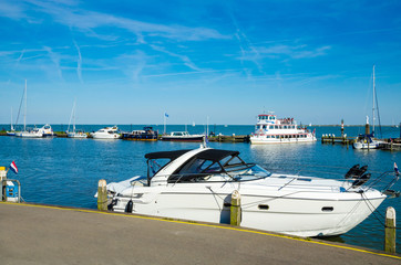 Fototapeta premium Yachts and sail boats in Volendam Harbor, Netherlands