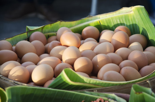 Eggs on banana leaf in basket