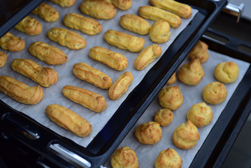 Freshly baked eclairs and profiteroles