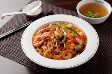 Delicious stir-fried rice noodles made from fresh mussels, shrimp, shellfish and seafood