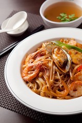 Delicious stir-fried rice noodles made from fresh mussels, shrimp, shellfish and seafood