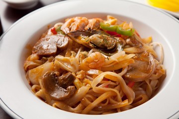 Delicious stir-fried rice noodles made from fresh mussels, shrimp, shellfish and seafood