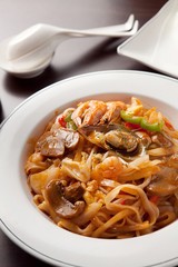 Tasty and spicy stir-fry rice noodles made with fresh beef and vegetables