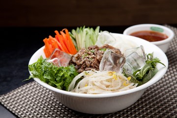 Tasty and spicy Bibim rice noodles made with fresh beef and vegetables