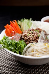Tasty and spicy Bibim rice noodles made with fresh beef and vegetables