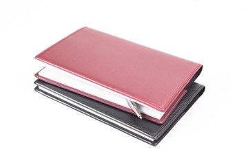 Notebook and pen isolated on white background