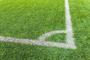 The football field corner with artificial grass