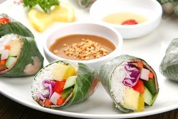 Spring rolls made from fresh vegetables and meat with peanut butter sauce