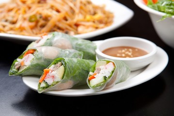 Spring rolls made from fresh vegetables and meat with peanut butter sauce