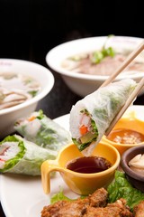 Fresh vegetables, various rolls of meat and crispy fried