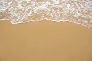 Soft wave of the sea on the sandy beach