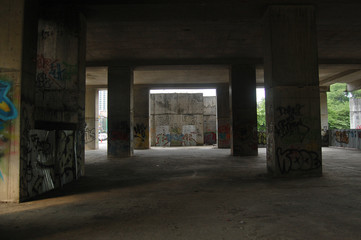 Fototapeta na wymiar Industrial interior of an abandoned car park 