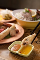 Fresh vegetables, various rolls of meat and crispy fried