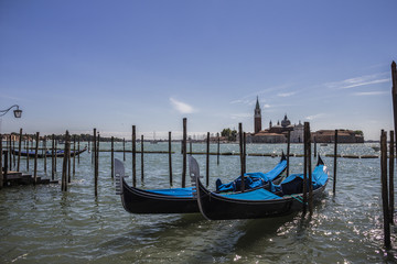 Gondolas and San Giorgio maggiore, view from San Marco square, in Venice, Italy