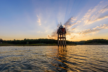 carcass of old temple at the lake in sunset time
