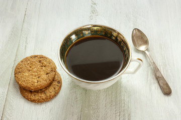 Black coffee with oatmeal cookies and copyspace