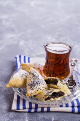 Triangular cookies with poppy seeds
