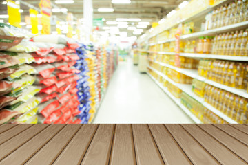  Empty wooden table over blurred shopping mall background, for product display montage.