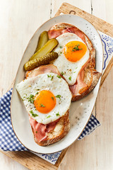 Tasty fresh fried eggs and bacon or ham
