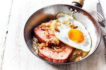 Close up view of country styled ham and onions