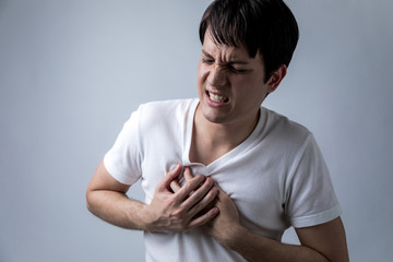 young man having a pain in his breast