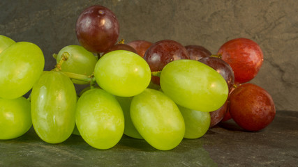 Fresh grapes on a background of slate
