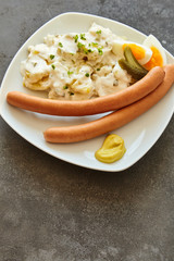 Overhead view of german kitchen meal bockwurst and potato salad