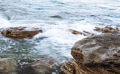 Waves crashing onto coast