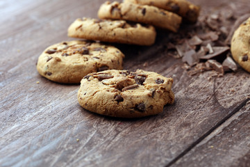 Chocolate cookies on wooden table. Chocolate chip cookies shot