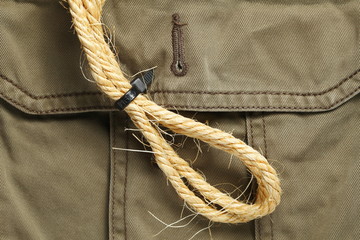 The old manila rope put on the pant pocket represent the adventure wear and apparel concept related background.
