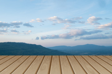 Wood table top on blur mountain background. Can be used for display or montage your products.
