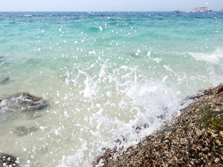 Sea and rock on island beach Thailand,Water splash