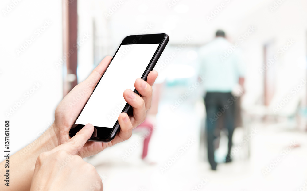Aufkleber Hand click mobile phone with blur patient at hospital background bokeh light,White screen mock up template for adding your design or your text