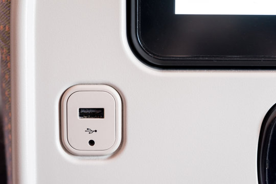 Close up usb socket charger at back of airplane seat.Digital lifestyle