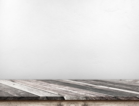 Empty grunge diagonal wood table top with white house concrete wall,Mock up for display or montage of product