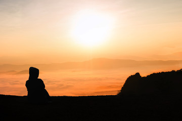 silhouette young woman watching sunset