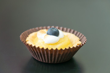 Passion fruit tart with blueberry on top