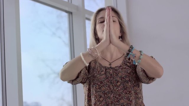 Yoga woman in special clothes calming her breathing