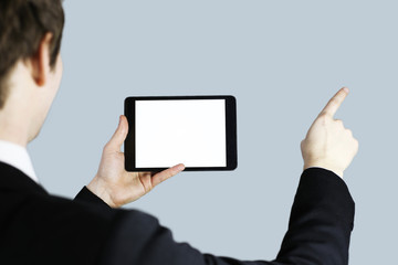 tablet in his hands. The working environment