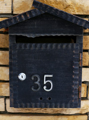 mailbox. Iron on a stone background