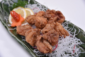 karaage Japanese fried Chicken closeup on white background