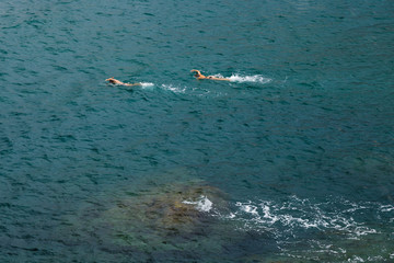 People float in the sea. Aerial view 