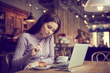 woman working with laptop in cafe. social network concept