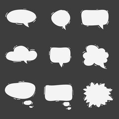 Set of cute hand drawn speech bubbles. Doodle style. Talk clouds sketching. Balloon shape. Vector illustration.