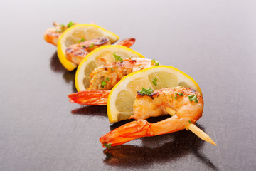 Grilled shrimps on skewer.
