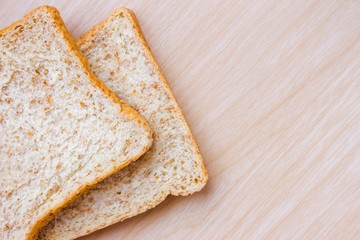 bread on wood table background / copy space / top view