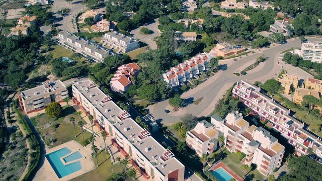 Flying Above Holiday Village on Shore Ocean