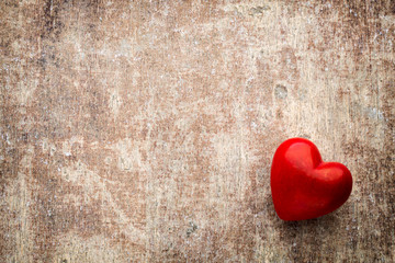 Red hearts on the wooden background.